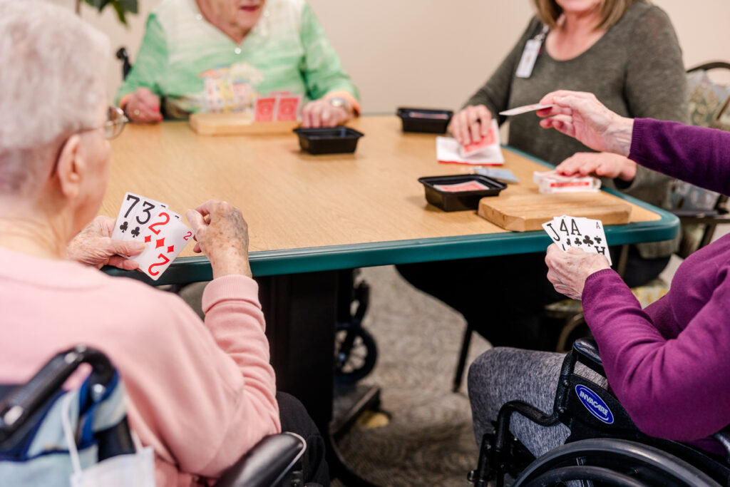 Residents Playing Cards Together | Pelican Valley Senior Living