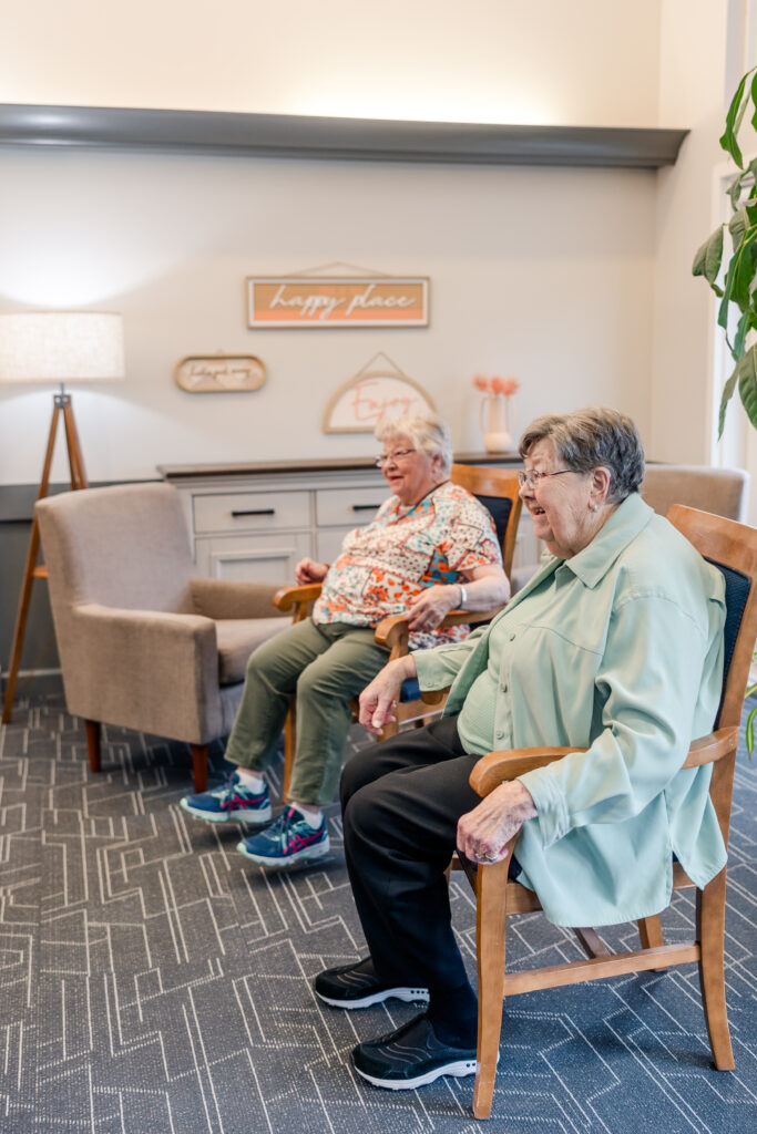 Riverfront Manor Residents Sitting Together | Pelican Valley Senior Living