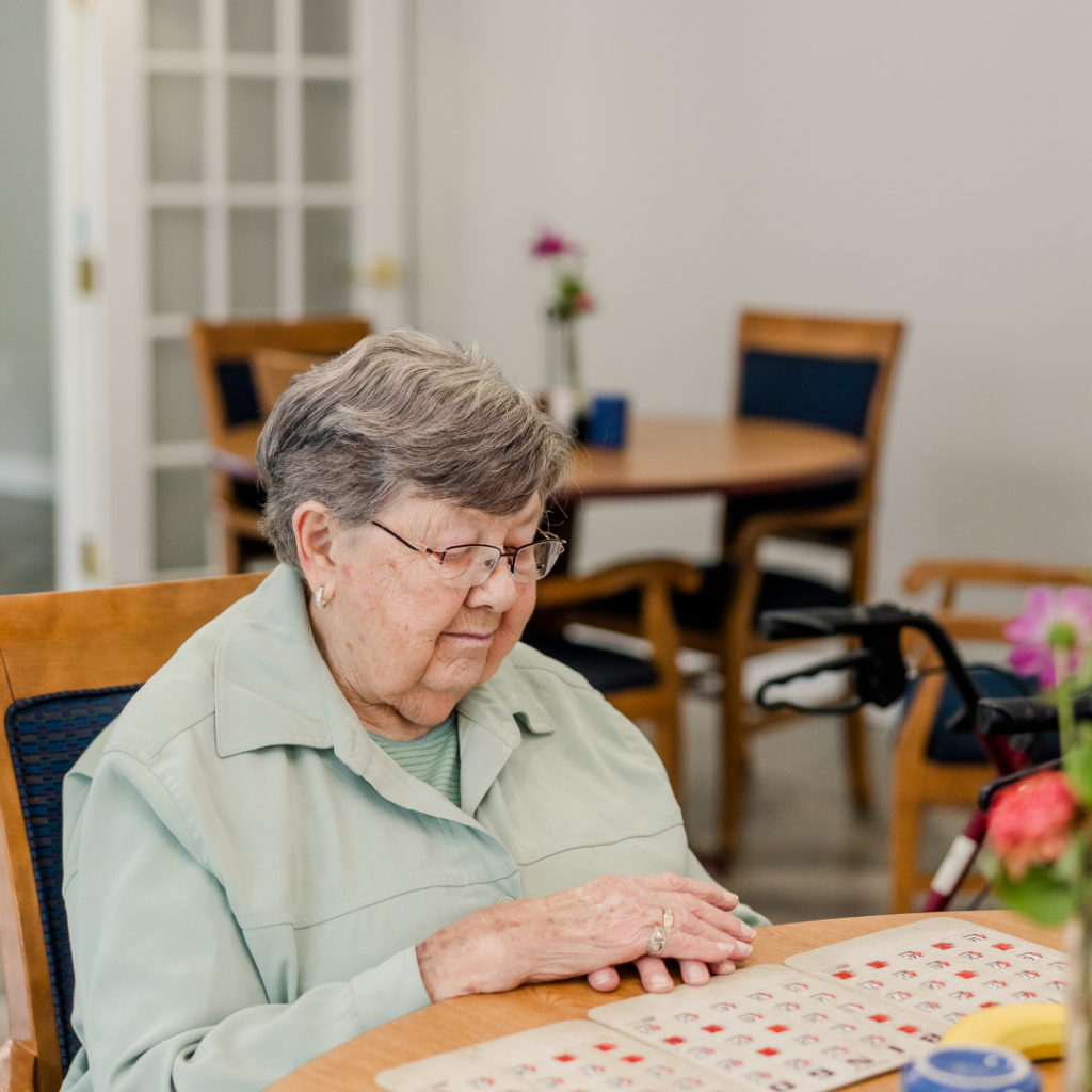 Resident Playing Bingo | Pelican Valley Senior Living