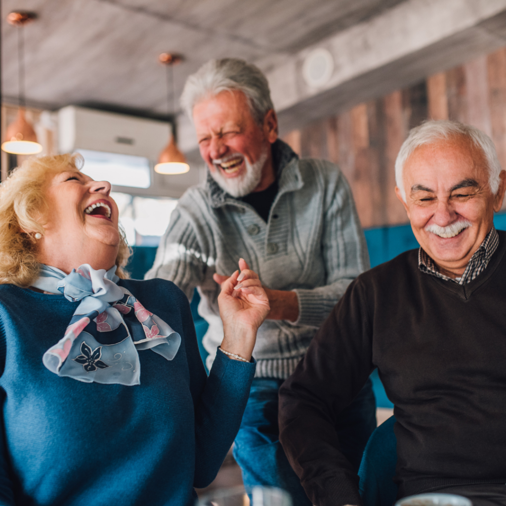 Three Seniors Laughing Together | Pelican Valley Senior Living